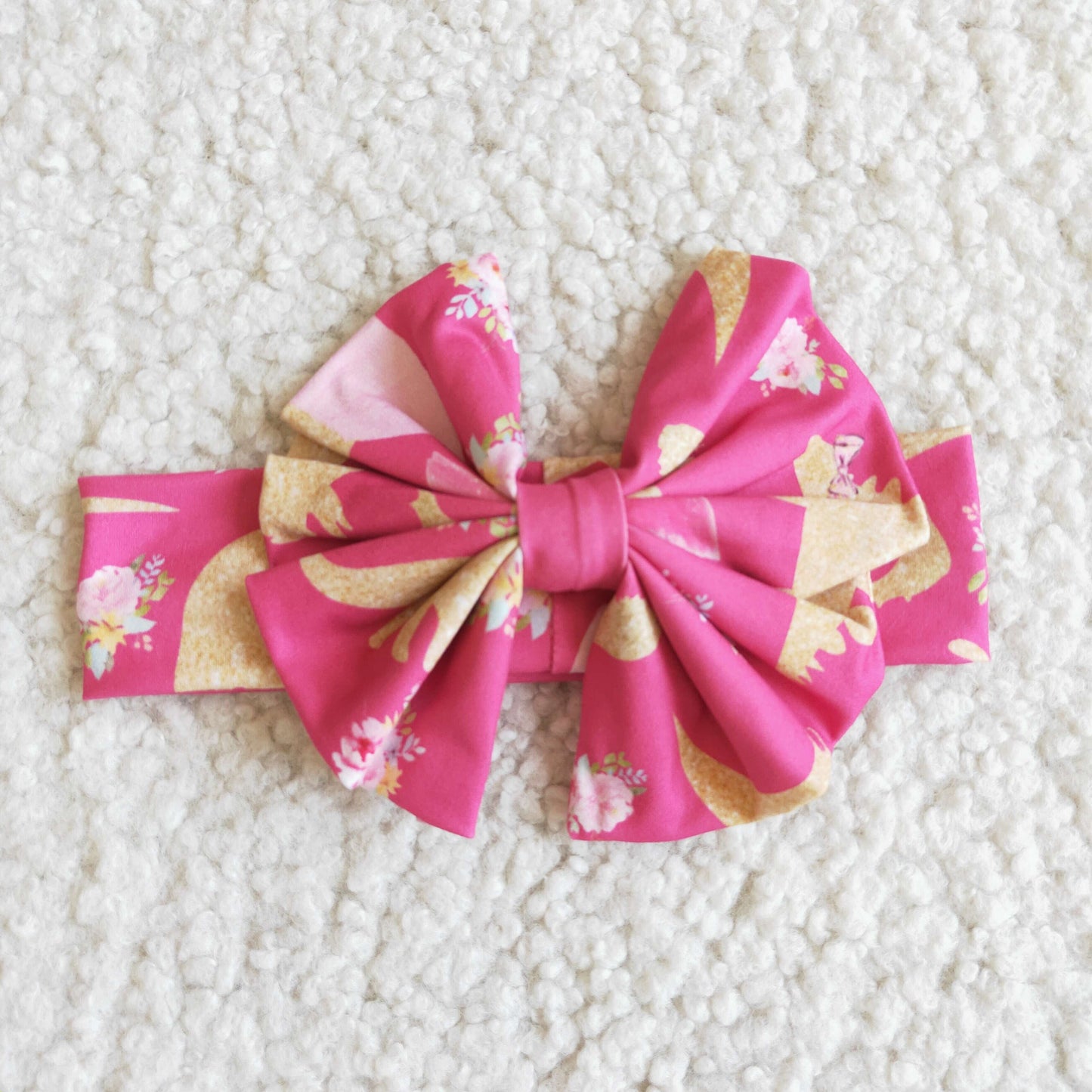 Pink dinosaur bow